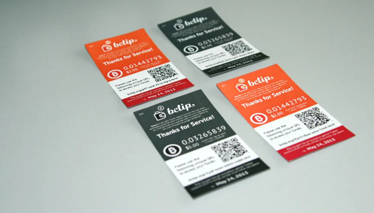Four printed bctip notes on a table, 2013